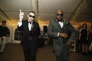 Two men dancing at wedding reception