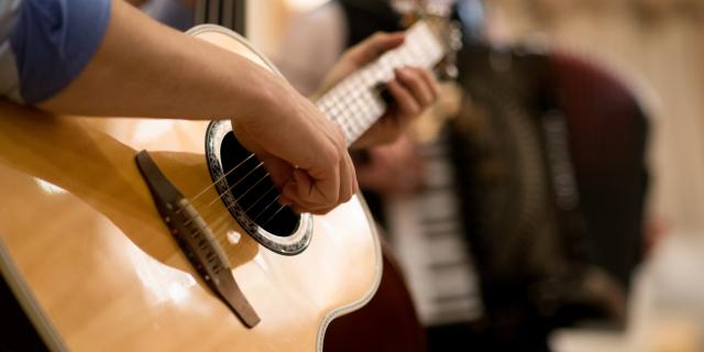 Basic Strumming With Your First Two Chords - Guitar Class