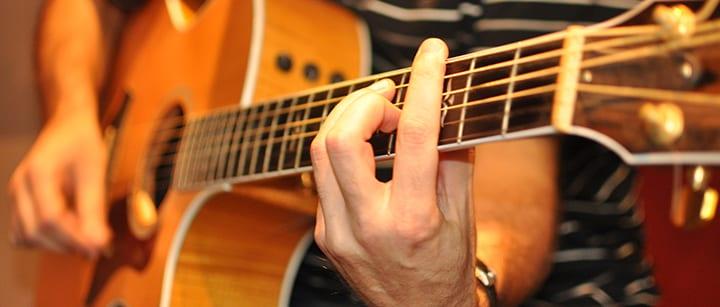 https://takelessons.com/blog/learn-to-play-acoustic-guitar-first