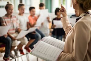 Close up of a group of students at a singing lesson