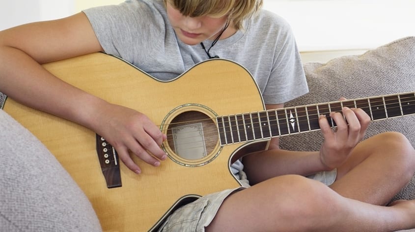 Child Playing Guitar