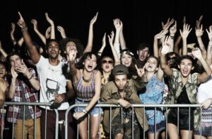 Group of excited young people at a music concert