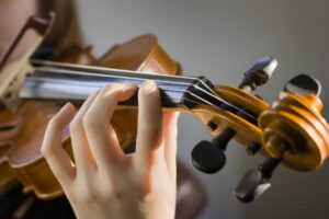 Close up of a person playing the violin