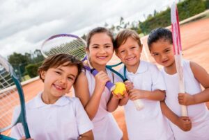 Group of kids at tennis practice
