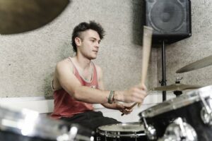 Young man playing the drums
