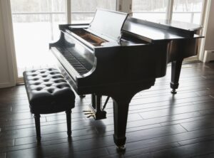 Beautiful brown piano in a clean bright room