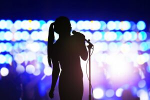 Silhouette of a female lead singer