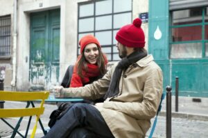Smiling couple talking outside of a café
