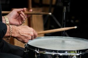 Close up of a man playing the drums