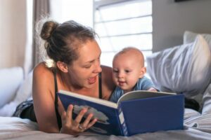 Mom reading to her baby