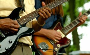 Closeup of two men playing guitar at a Blues festival