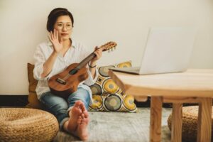 Female ukulele instructor giving an online lesson