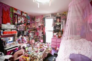 Woman's pink room filled with toys