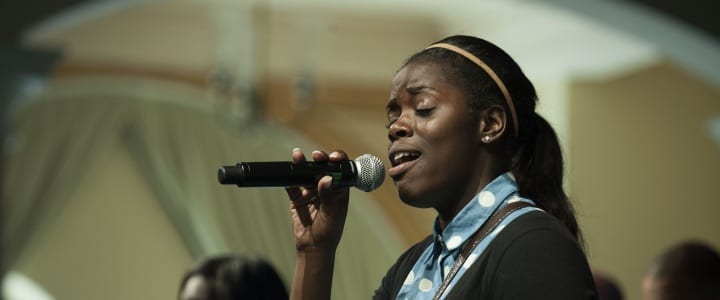 girl singing - choir audition songs & tips