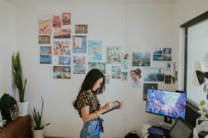 Young woman designing art in her office 