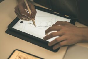 Close up of someone drawing an a tablet