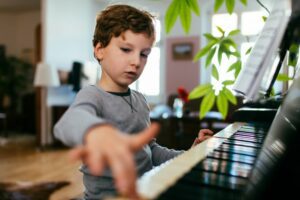 Little boy practicing the piano