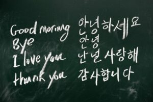 Chalkboard with korean translations written on it
