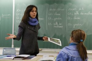 Female instructor teaching French to a female student