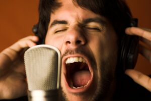Man yelling into microphone