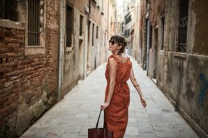 Woman walking down an alley in Italy
