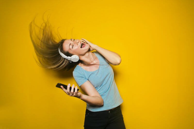 Girl Listening to Music - Songs That Make You Happy