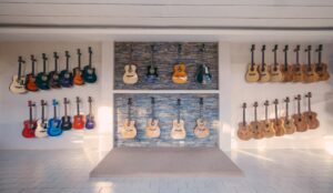 Different types of guitars hanging on a wall