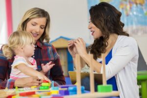 Mother and daughter learning sign language at a pre-school