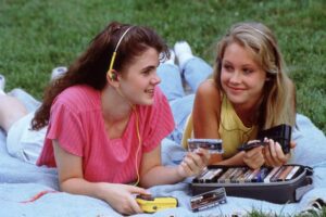 Two girls listening to cassette tapes