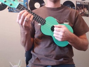 How to hold a ukulele: front view