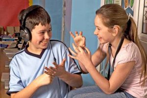 two young people using asl