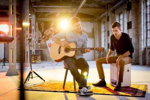 two musicians pursuing guitar and music careers together