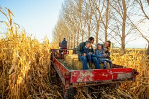 Happy family on a hay ride