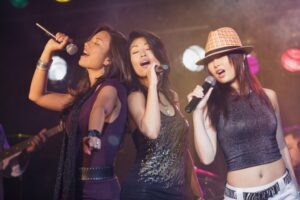 Female singing group on stage at a concert