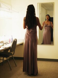 Opera singer warming up in her dressing room
