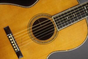 Close up of a sunburst acoustic guitar