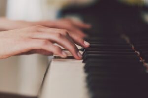 Close up of a woman playing the piano