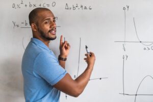 Male tutor teaching an SAT math course 